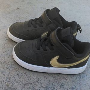 Black and gold toddler Nike. Size 7c
